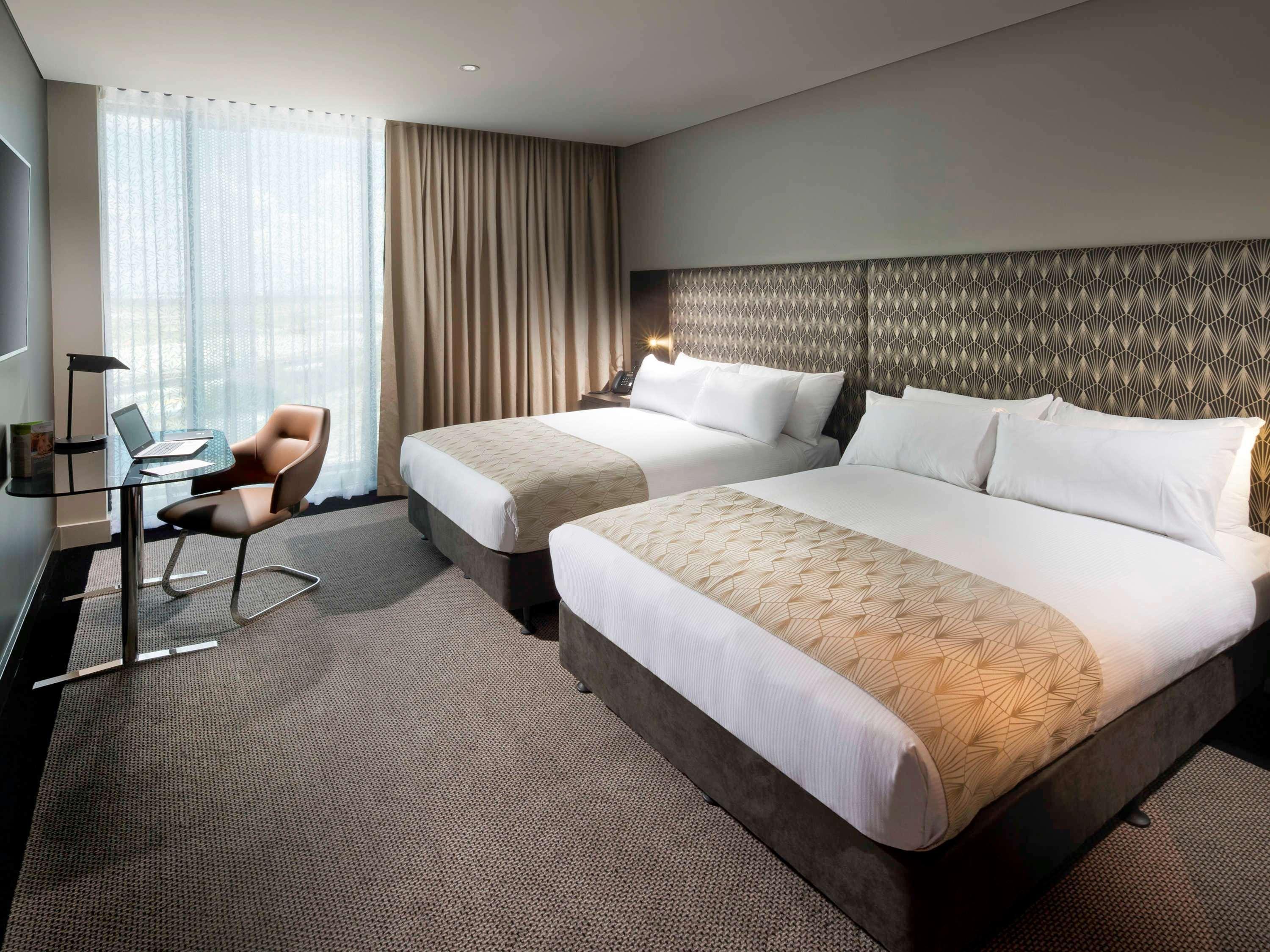 Hotel Pullman Brisbane Airport Exteriér fotografie A room at the hotel